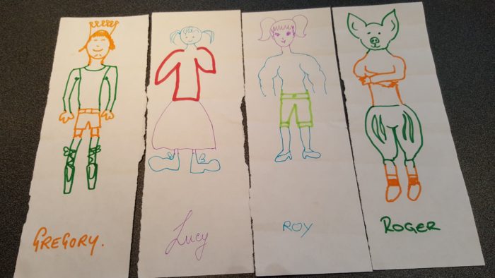 Children's drawings of people created by different children adding parts to the picture